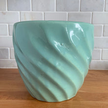 Load image into Gallery viewer, Vintage aqua round swirl ceramic stoneware planter featuring. Crafted by Robinson Ransbottom Pottery Co., USA, 1950s. A beautiful piece to add to your art pottery collection and plant up your favourite plants!

In excellent condition, no chips/cracks/repairs. Manufacturer&#39;s glaze pops. Maker&#39;s marks.

Measures 7 3/8 x 6 5/8 inches
