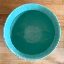 Load image into Gallery viewer, Large vintage aqua gloss glazed Tierra Cushion jardiniere planter pot, features an overlapping floral leaf rim and diamond quilted body with ribbon handles. Crafted by McCoy Pottery, USA, 1950s. A must-have for any McCoy collector or container gardener!

In excellent condition, no chips/cracks/repairs, manufacturer&#39;s glaze pops. Maker&#39;s mark.

Measures 10 3/8 x 8 1/2 inches
