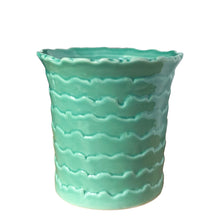 Load image into Gallery viewer, Close-up of hand-crafted wave pattern on aqua turquoise ceramic planter showing textured surface detail
