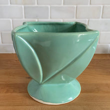 Load image into Gallery viewer, Vintage aqua twisted square footed ceramic jardiniere planter 1240/65. Crafted by Robinson Ransbottom Pottery Co., USA, 1940s. A beautiful home for your favourite houseplant and a wonderful addition to your art pottery collection!

In excellent condition, no chips/cracks/repairs. Typical age-related crazing and manufacturer&#39;s glaze pops.

Measures 6 1/2 x 6 1/2 x 6 1/8 inches
