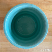 Load image into Gallery viewer, Vintage aqua blue glaze ceramic jardiniere planter featuring stacked body with embossed flowers, 1631. Crafted by Robinson Ransbottom Pottery Co., USA, 1940s. A beautiful piece to add to your art pottery collection!

In excellent condition, no chips/cracks/repairs. Typical manufacturers glaze pops. Maker&#39;s marks.

7 3/4 Inch: measures 7 3/4 x 6 1/2 inches
