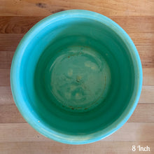 Load image into Gallery viewer, Vintage aqua blue glaze ceramic jardiniere planter featuring stacked body with embossed flowers, 1631. Crafted by Robinson Ransbottom Pottery Co., USA, 1940s. A beautiful piece to add to your art pottery collection!

In excellent condition, no chips/cracks/repairs. Typical manufacturers glaze pops. Maker&#39;s marks.

8 Inch: measures 8 x 6 1/2 inches
