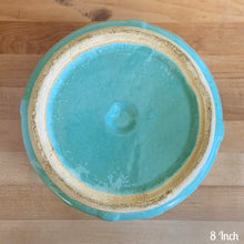 Load image into Gallery viewer, Vintage aqua blue glaze ceramic jardiniere planter featuring stacked body with embossed flowers, 1631. Crafted by Robinson Ransbottom Pottery Co., USA, 1940s. A beautiful piece to add to your art pottery collection!

In excellent condition, no chips/cracks/repairs. Typical manufacturers glaze pops. Maker&#39;s marks.

8 Inch: measures 8 x 6 1/2 inches
