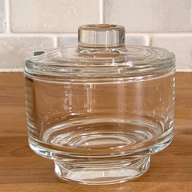 Clear glass covered sugar bowl designed by Joe Colombo for Arno of Italy, circa 1960s. It is rare to find this clear glass version of this Italian glassware. Each piece has a sleek mid century modernist geometric design with a silhouette that makes the contents in this pressed glass appear suspended above the table surface.  In excellent condition, free from chips. Marked on the bottom 