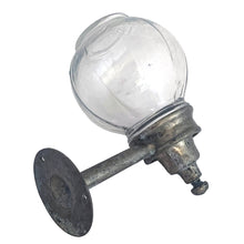 Load image into Gallery viewer, Vintage Art Deco glass globe wall-mounted cast metal industrial soap dispenser. These were typically found in classic bathrooms, gas stations, or public lavatories in the early to mid-20th century. This dispenser adds historical charm to farmhouse, industrial, or authentic restorations.

In as found used vintage condition, no chips in the glass, metal bracket shows patina and age-related wear. Requires restoration.

Measures 5 3/4 inches tall and extends 5 3/4 inches from the wall. Globe 3 1/2 inches
