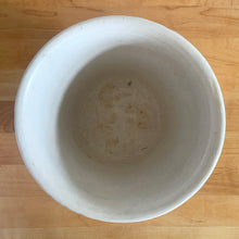 Load image into Gallery viewer, Vintage art deco matte white ceramic jardiniere planter featuring repeating columns of stacked palm leaves atop a basket weave pattern. Crafted by Robinson Ransbottom Pottery Co., USA, 1930s. A beautiful piece to add to your art pottery collection!

In excellent condition, no chips/cracks/repairs. Typical manufacturing glaze pops. Unmarked.

Measures 7 3/8 x 5 1/2 inches
