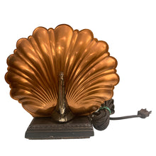 Load image into Gallery viewer, Vintage art deco peacock TV table lamp features a cast metal base, chrome plated peacock body and stamped copper feather fan. The bottom is stamped with a crest with the letters SP, but we are unable to determine the maker. Given that peacock are considered to be exotic, this piece of lighting history shows off the height of sophistication in the art deco era!

In as found vintage condition with significant wear to the chrome and a nice overall patina.

Measures 8 7/8 x 3 1/2 x 8 1/4 inches
