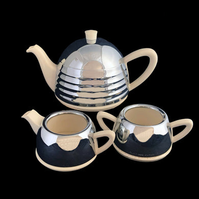 Lovely art deco vintage teapot with brewing basket and insulated stainless steel beehive style cover along with coordinating, creamer and sugar similarly treated with smooth covers. Crafted by 