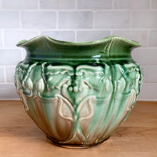 Load image into Gallery viewer, Vintage Art Nouveau style green drip glazed majolica ceramic jardiniere planter with floral pattern and scalloped edge. Crafted by WF Needham, England, early 1900s. Fill this beauty with your favourite plants or use as decor!

In as found condition, with chip and L shaped crack. Marked England.

Measures 8 x 6 1/4 inches
