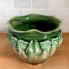 Load image into Gallery viewer, Vintage Art Nouveau style green drip glazed majolica ceramic jardiniere planter with floral pattern and scalloped edge. Crafted by WF Needham, England, early 1900s. Fill this beauty with your favourite plants or use as decor!

In as found condition, with chip and L shaped crack. Marked England.

Measures 8 x 6 1/4 inches

