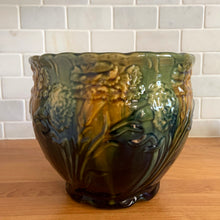 Load image into Gallery viewer, Vintage Art Nouveau drip glazed majolica footed ceramic jardiniere planter features a floral pattern in green, ochre and navy, with scalloped rim. Attributed to WF Needham, England, early 1900s. Fill this beauty with your favourite plants or use as decor!

In excellent condition, no chips/cracks/repairs, normal age-related crazing. Unmarked.

Measures 8 x 6 1/4 inches
