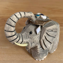 Load image into Gallery viewer, Artesania Rinconada elephant figurine, left three-quarter view, trunk raised in a full curl, cream tusks, handmade art pottery, Uruguay, vintage
