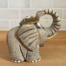 Load image into Gallery viewer, Artesania Rinconada elephant figurine, opposite side view, trunk raised, textured grey clay body with incised line detailing, handmade art pottery, Uruguay, vintage
