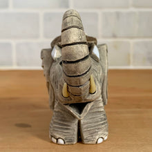 Load image into Gallery viewer, Artesania Rinconada elephant figurine, front view, trunk raised vertically, cream tusks visible, wide-set ears, white toenails, handmade art pottery, Uruguay, vintage
