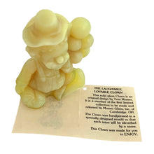 Load image into Gallery viewer, Vintage Arty All the World Loves a Clown vaseline uranium slag glass figurine. Crafted by Mosser Glass, USA, 1981 - 1982. This adorable little clown holding a bunch of balloons glows beautifully under black light. An adorable collectible!

In like new condition, in original box with leaflet.

Measures 2 3/4 x 1 3/8 x 3 1/2 inches
