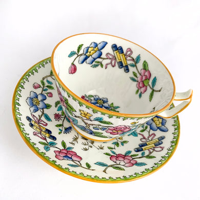 Vintage hand painted, multi-colour Asian rose flowered teacup in the Chinoiserie style is a rare pattern produced by Hammersley and Company, Bone China, England, circa 1940s. Painted in the interior and exterior, the flowers are shades of blue, pink, yellow and green featuring a pair of scrolls tied with a pink bow. Makes a lovely gift for any occasion. Excellent condition, free from chips, cracks or repairs. Teacup measures3 1/2 x 2 1/4 inches. Saucer measures 5 1/4 inches