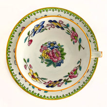 Load image into Gallery viewer, Vintage hand painted, multi-colour Asian rose flowered teacup in the Chinoiserie style is a rare pattern produced by Hammersley and Company, Bone China, England, circa 1940s. Painted in the interior and exterior, the flowers are shades of blue, pink, yellow and green featuring a pair of scrolls tied with a pink bow. Makes a lovely gift for any occasion. Excellent condition, free from chips, cracks or repairs. Teacup measures3 1/2 x 2 1/4 inches. Saucer measures 5 1/4 inches
