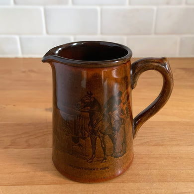 Vintage Athlo Ware Sports & Pastimes M&M brown glazed creamer pitcher featuring The Huntsman's Home scene in black. Crafted by Price Bros., England.

In excellent condition, no chips/cracks/repairs. Maker's marks.

Measures 4 x 2 3/4 x 3 5/8