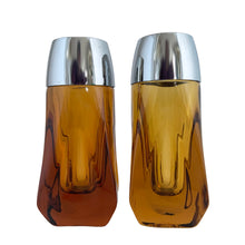 Load image into Gallery viewer, Vintage atomic amber glass salt and pepper shakers with plasticized chrome lids. Crafted by Libbey Glass, 1960s. Add this classic to your tableware collection!

In excellent condition, no chips.

Measures 1 5/8 x 1 5/8 x 4 1/8 inches
