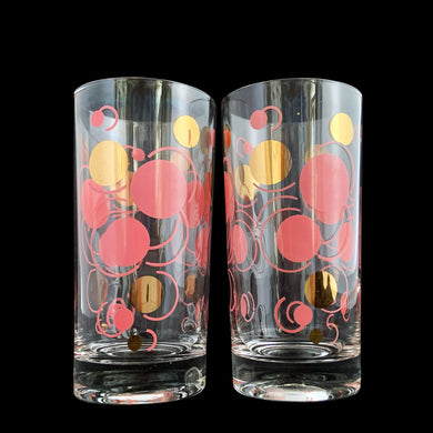 Pair of vintage mid century era pink and gold Atomic Dots cocktail glass tumblers. Crafted by Federal Glass, USA, circa 1950s. These hard-to-find tumblers are spectacular with their effervescent rising bubbles. They are sure to be the stars of your bar cart...cheers!

In great vintage condition, no chips, very minor age related wear to the gold.

Measures 2 3/4 x 5 1/2 inches

Capacity 14 ounces