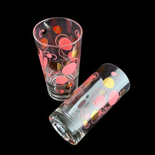 Load image into Gallery viewer, Pair of vintage mid century era pink and gold Atomic Dots cocktail glass tumblers. Crafted by Federal Glass, USA, circa 1950s. These hard-to-find tumblers are spectacular with their effervescent rising bubbles. They are sure to be the stars of your bar cart...cheers!

In great vintage condition, no chips, very minor age related wear to the gold.

Measures 2 3/4 x 5 1/2 inches

Capacity 14 ounces
