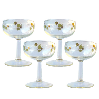 Set of four vintage mid-century era avocado green and gold Atomic Dots champagne coupe cocktail glasses! Crafted by Federal Glass, USA, 1950s. Use these effervescent beauties to serve your favourite champers, martinis or use them as sherbets. Your bar cart will be the star of the show with their effervescent rising bubbles.....cheers!

In excellent condition, no chips.

Measures 3 1/2 x 4 1/4 inches

Capacity 6 ounces