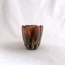 Load image into Gallery viewer, Vintage oval shaped redware pottery planter, finished with Aurora Borealis drip glaze in tones of brown, toffee and green on a lily pattern. Produced by CCC Pottery, Canada, circa 1960s.   In excellent condition, free from cracks/repairs. A couple of minor flea bites to the rim which aren&#39;t too noticeable thanks to the colour of the redware.  Measures 8 3 1/8 x 3 1/8 inches
