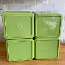Load image into Gallery viewer, Vintage set of four retro avocado green plastic kitchen canisters topped with brown lids. Each has funky retro deboosed typography in brown. Includes flour, sugar, cookies and tea. Crafted by Beacon Plastics, Canada, 1970s. Add these beauties to retro-fy your kitchen countertop!

In great vintage condition. These canisters appear to be well cared for, with age appropriate wear to the plastic. Maker&#39;s mark on the bottom.
