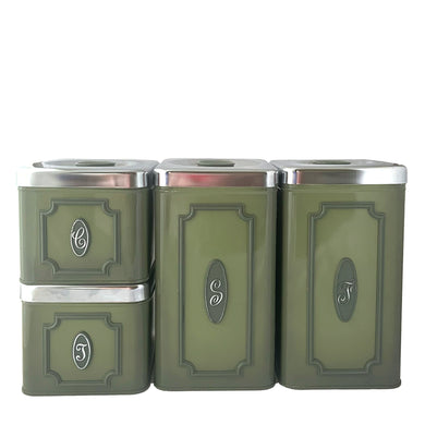 Vintage set of four avocado green retro kitchen canisters topped with chrome lids and green knobs. Each has period style typography in green plastic medallion with a silver letter to represent flour, sugar, coffee and tea. EKCO, Canada, 1970s. Add these beauties to retrofy your countertop! Great vintage condition. Canisters appear to be well cared for, with age appropriate wear to the paint mainly on the Sugar and Flour canisters. Stamped on the bottom with Made in Canada.