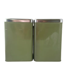 Load image into Gallery viewer, Vintage set of four avocado green retro kitchen canisters topped with chrome lids and green knobs. Each has period style typography in green plastic medallion with a silver letter to represent flour, sugar, coffee and tea. EKCO, Canada, 1970s. Add these beauties to retrofy your countertop! Great vintage condition. Canisters appear to be well cared for, with age appropriate wear to the paint mainly on the Sugar and Flour canisters. Stamped on the bottom with Made in Canada.
