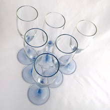 Load image into Gallery viewer, Set of six, delightful vintage Luminarc "Azur" pale blue stemmed champagne flute glasses. Crafted by Cristal d'Arques-Durand, France, between 1991 - 2006. The prettiest glass for any special occasion or to ring in the New Year!  In excellent condition, free from chips/cracks.  Measures 2 3/4 x 8 5/8 inches
