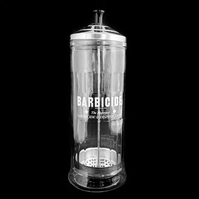 Originally created by a science teacher, this fantastic vintage Barbicide pressed glass canister jar has been the trusted vessel for holding germicide and disinfectant for over 75 years!  These jars are in every barber and hair stylists shops to disinfect scissors, combs and other hair care tools. Use as intended or repurpose to hold straws for a fun diner vibe!  Measures 4 1/4 x 11 inches. Marked 
