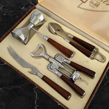 Load image into Gallery viewer, Fabulous mid-century vintage four piece &quot;Barmates&quot; cocktail bar tool set, presented in the original satin lined box. Set includes double sided jigger, corkscrew bottle opener, tongs, and bar knife. Each chrome plated tool has a gorgeous dark amber bakelite handle. Crafted by Glo-Hill of Canada, circa 1950s. A truly stunning set! In excellent like-new condition. Minor wear to the box.
