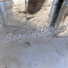 Load image into Gallery viewer, Close-up of embossed BeautyWare script logo on vintage chrome steel canister base, mid-century kitchenware

