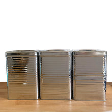 Load image into Gallery viewer, Side view of Vintage Lincoln BeautyWare 4-piece chrome kitchen canister set, embossed Flour Sugar Coffee Tea lettering, ribbed steel, 1940s USA
