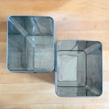 Load image into Gallery viewer, Overhead view of vintage Lincoln BeautyWare chrome kitchen canisters showing ribbed steel interior, large pair
