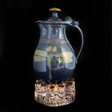 Load image into Gallery viewer, Stunning hand crafted BelMondo glass trivet with a tree-like root structure design. Intended to be used as a trivet or warmer in conjunction with a tealight to keep a pot warm. May be used to keep beverages or foods warm. Crafted by Glasdesign George Schütte, West Germany, circa 1980s. An impressive piece of textured glass that refracts light like magic!  In excellent condition, free from chips/wear.  Measures 2 1/2 x 6 inches
