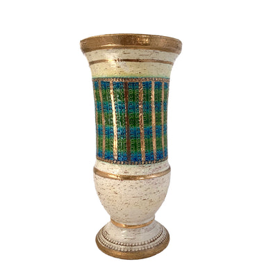 Vintage MCM art pottery footed vase with a band of repeating dots and stripes in shades of blue, green and gold on a pales butter yellow ground with gold details and green interior. Crafted by Bitossi Ceramiche, Italy 1960s. A wonderful piece of mid-century era art pottery to enhance your home's decor.

In good vintage condition, minor flea bit at the rim, no cracks or repairs. Sign on the bottom, 630 Italy.

Measures 6 x 12 3/4 inches
