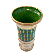 Load image into Gallery viewer, Vintage MCM art pottery footed vase with a band of repeating dots and stripes in shades of blue, green and gold on a pales butter yellow ground with gold details and green interior. Crafted by Bitossi Ceramiche, Italy 1960s. A wonderful piece of mid-century era art pottery to enhance your home's decor.

In good vintage condition, minor flea bit at the rim, no cracks or repairs. Sign on the bottom, 630 Italy.

Measures 6 x 12 3/4 inches
