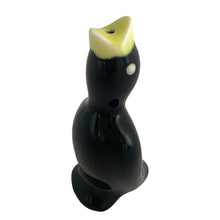 Load image into Gallery viewer, Vintage ceramic black pie bird with a yellow beak and eyes. Crafted by Norpro, Taiwan, 1980s. An essential accessory for the pie baker that allows steam to vent while a pie is baking to help prevent the fruit from bubbling over.  In excellent condition, no chips.  Measures 1 3/4 x 1 3/4 x 3 7/8 inches
