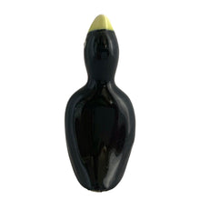 Load image into Gallery viewer, Vintage ceramic black pie bird with a yellow beak and eyes. Crafted by Norpro, Taiwan, 1980s. An essential accessory for the pie baker that allows steam to vent while a pie is baking to help prevent the fruit from bubbling over.  In excellent condition, no chips.  Measures 1 3/4 x 1 3/4 x 3 7/8 inches
