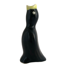 Load image into Gallery viewer, Vintage ceramic black pie bird with a yellow beak and eyes. Crafted by Norpro, Taiwan, 1980s. An essential accessory for the pie baker that allows steam to vent while a pie is baking to help prevent the fruit from bubbling over.  In excellent condition, no chips.  Measures 1 3/4 x 1 3/4 x 3 7/8 inches
