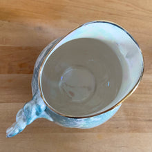 Load image into Gallery viewer, Beautiful vintage iridescent blue Brocade bone china milk or cream pitcher jug, rimmed in gold gilt. Crafted by Royal Winton Grimwades, England, between 1934 - 1950. A stunning example of Chintz and cottage and shabby chic style!

In great vintage condition, no chips/cracks/repairs, age-related crazing, minor wear to the gold rim, see photos.

Measures 6 1/4 x 4 x 4 3/4 inches
