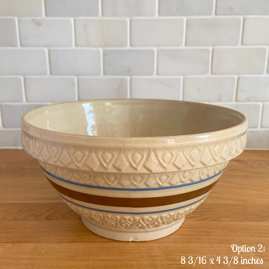 Vintage yellow ware mixing bowl featuring brown and blue bands with diamond pattern. Crafted by Robinson Ransbottom, USA, 1930s. A well-crafted piece of stoneware offering a nostalgic vibe to your farmhouse or cottage kitchenware and decor!

Option 2: Measures 8 3/16 x 4 3/8 inches. In as found condition, chip to the foot and rim, no cracks/repairs, age-related crazing. Crown mark.
