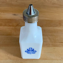 Load image into Gallery viewer, Classic vintage white milk glass vinegar dispenser, featuring blue cornflowers and a plasticized chrome lid. Crafted by Dominion Glass Canada, circa 1970.  In excellent condition&nbsp;with only minor wear to the chrome, the glass is free from chips/cracks.  Measures 2 x 2 x 6 inches
