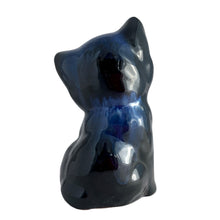 Load image into Gallery viewer, Charming vintage redware cat figurine finished in blue drip glaze. Crafted by the artists of Blue Mountain Pottery in the 1970s. This nostaligc piece of Canadian craftsmanship is the purr-fect addition to your art pottery collection.

Excellent condition, no chips, cracks or repairs. Unmarked.

Measures 3 x 2 3/4 x 5 1/2 inches
