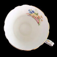 Load image into Gallery viewer, Vintage fine bone china blue teacup and saucer with colourful roses and gold gilt filigree and trim. Crafted by PARAGON, England. A lovely way to enjoy a cuppa tea!

In excellent condition, no chips, cracks or repairs. Single warrant stamp.

Measures 3 1/4 x 2 7/8 inches | Saucer measures 5 5/8 inches
