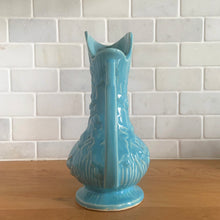Load image into Gallery viewer, Vintage Art Deco gloss blue Rustic Line handled pitcher vase with embossed grapevines. Crafted by McCoy Pottery, 1945. This rare piece is must for any McCoy art pottery collector!

In excellent vintage condition, no chips/cracks/repairs. Maker&#39;s mark.

Measures 5 1/4 x 9 inches
