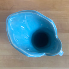 Load image into Gallery viewer, Vintage Art Deco gloss blue Rustic Line handled pitcher vase with embossed grapevines. Crafted by McCoy Pottery, 1945. This rare piece is must for any McCoy art pottery collector!

In excellent vintage condition, no chips/cracks/repairs. Maker&#39;s mark.

Measures 5 1/4 x 9 inches
