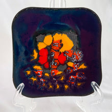 Load image into Gallery viewer, Beautiful deep blue copper enamel wall square wall plaque featuring a floral design in shades of yellow, red and orange. Created by artist B.E. Eren (signed) in 1979, Canada. Mounted on a wood back with a metal hanger. A beautiful original handmade artisan creation!  Measure 5 x 5 inches
